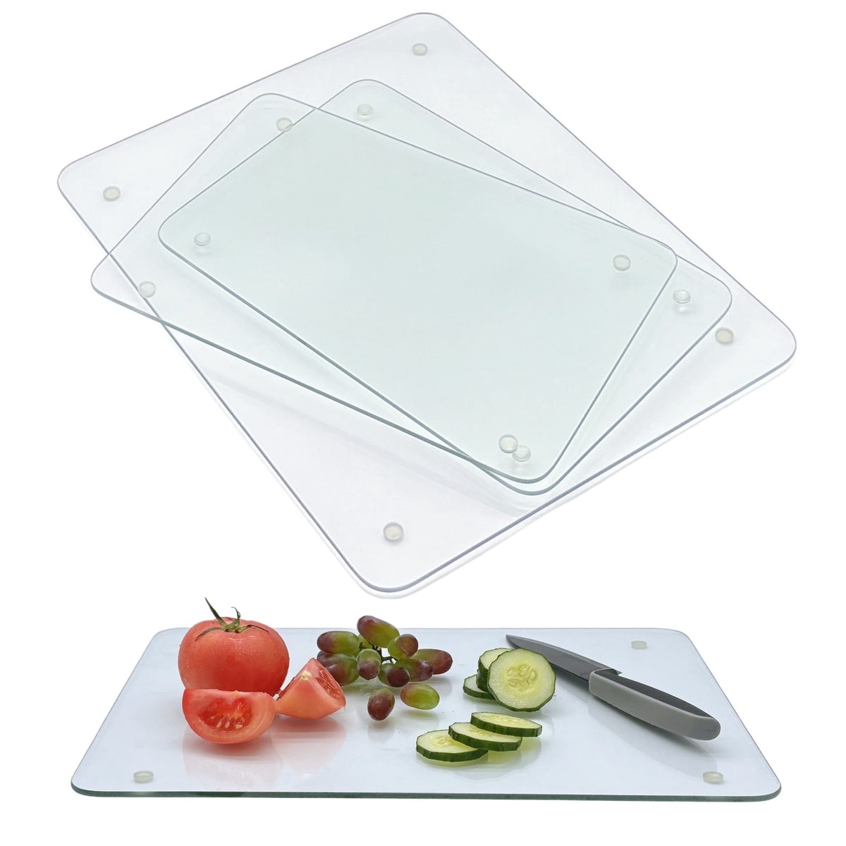 Set of 4 tempered glass cutting boards — three boards fanned out to show both sizes, with a fourth in use slicing tomato and cucumber